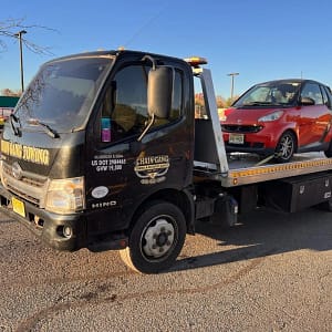 Flatbed towing Smart car